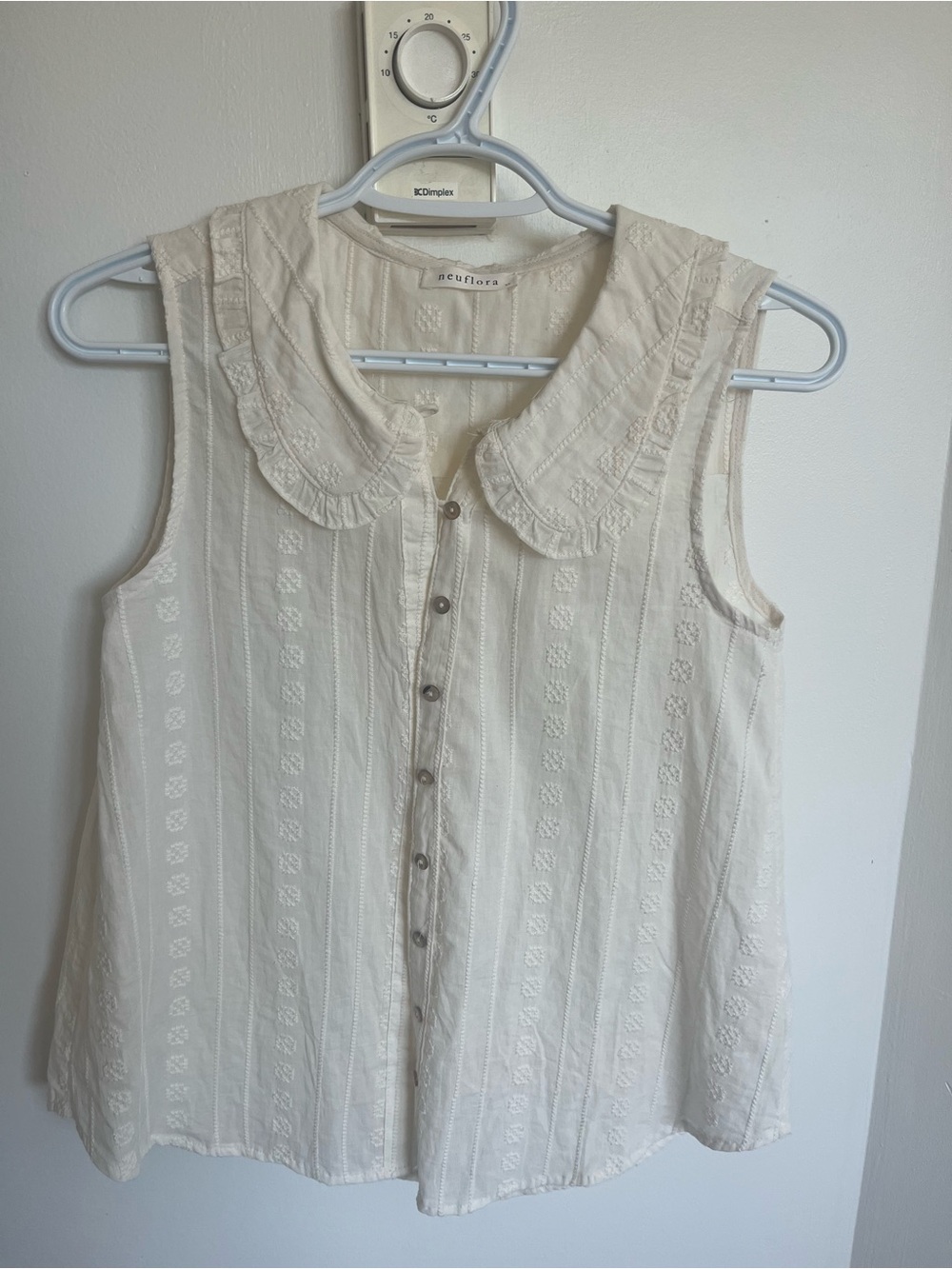 Sleeveless Cream Button-Front Top with Ruffled Collar